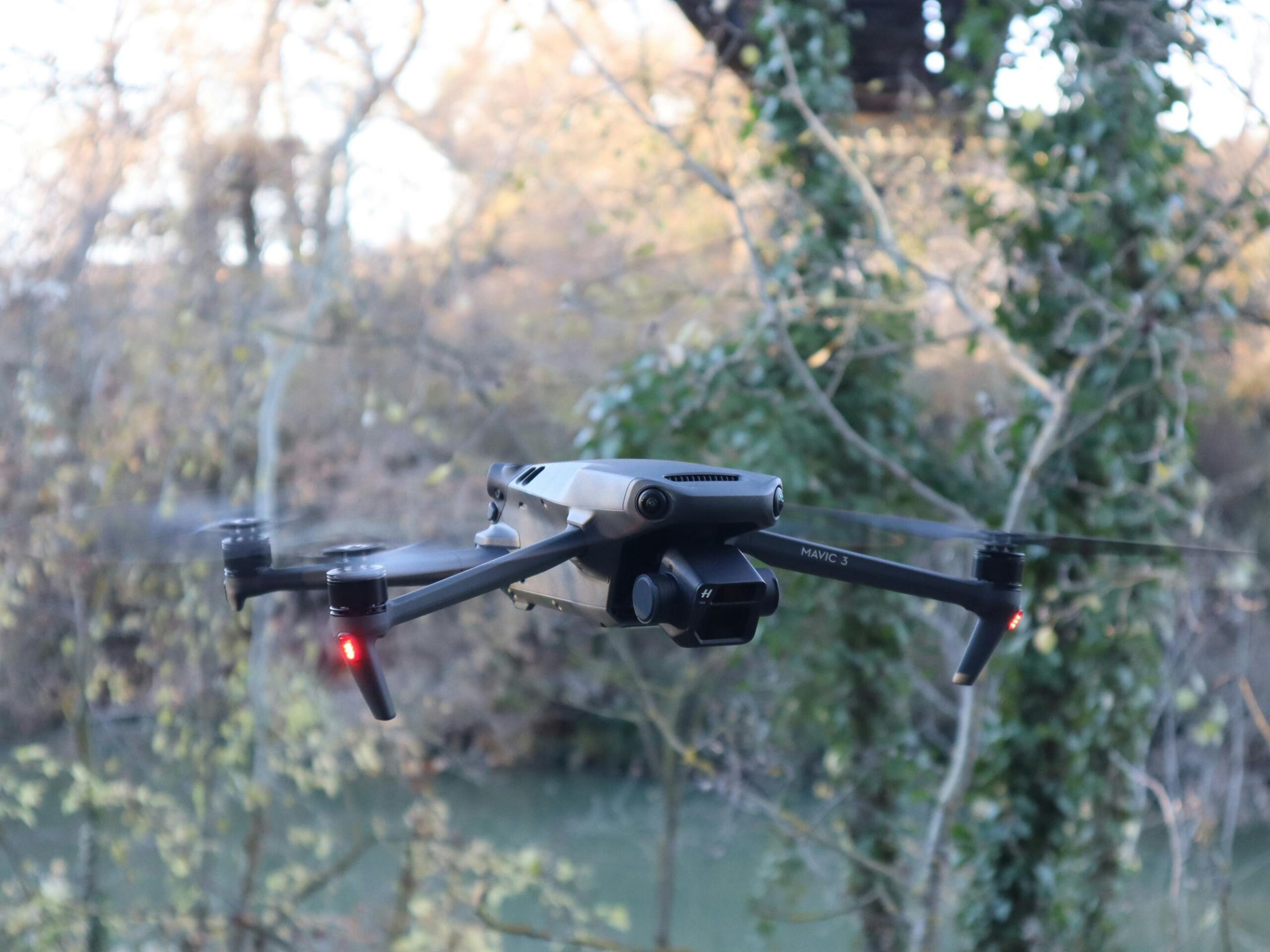 A drone captured in flight over a lush, natural landscape in Valladolid, Spain.